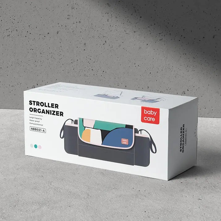 BC Babycare Stroller Organizer on a concrete surface, dark gray with color-block interior and detachable straps