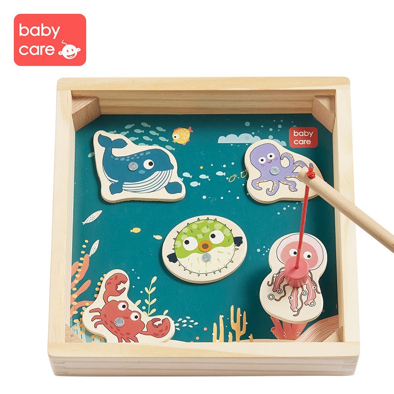 BC Babycare wooden fishing game set with colorful sea creatures and a fishing rod on a blue tray