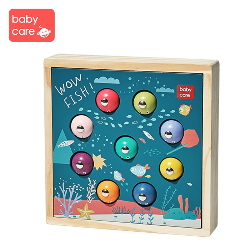 BC Babycare wooden fishing game set with colorful fish pieces on a blue sea backdrop