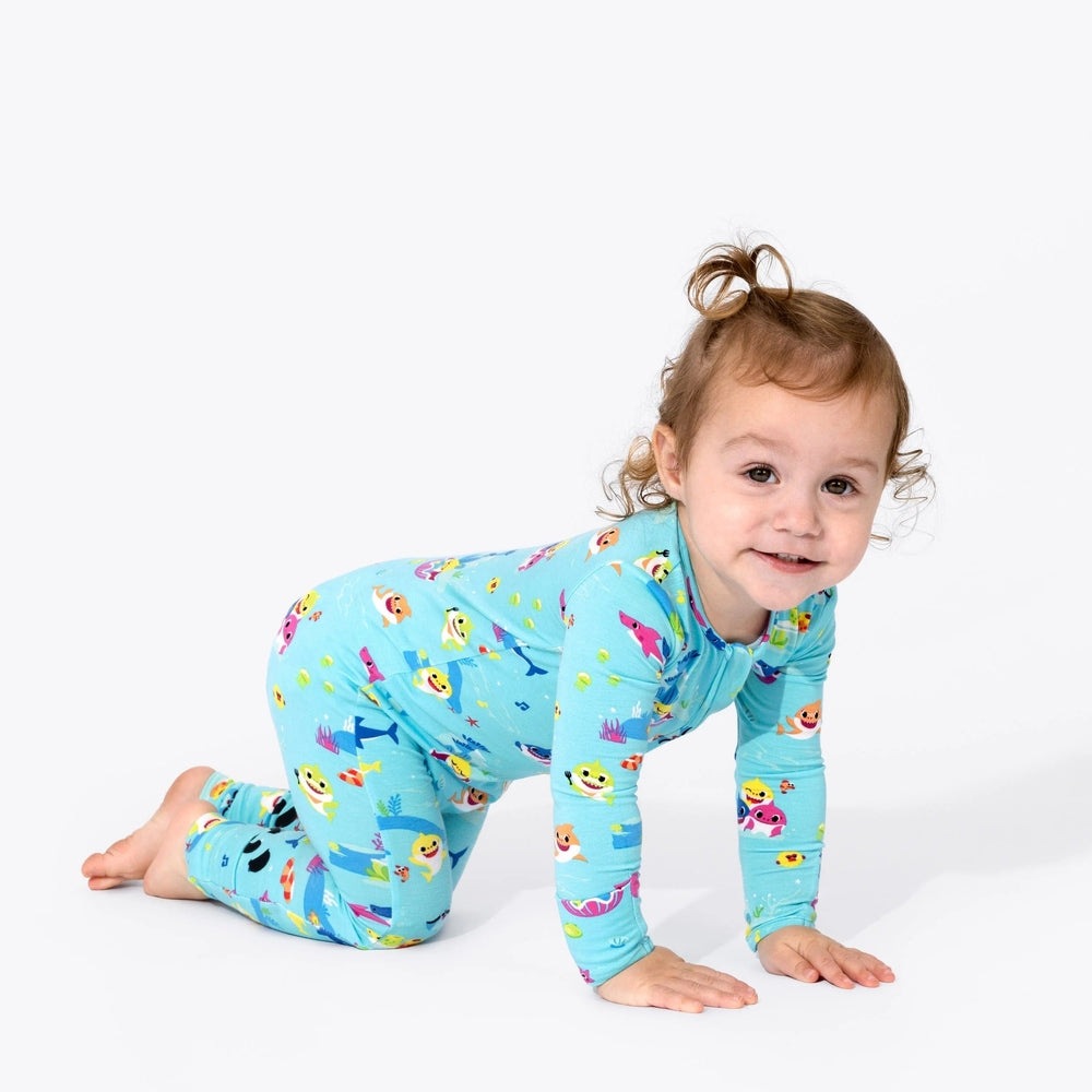 Bellabu Bear Bamboo Convertible Footie Baby Shark in light blue; baby crawls on hands and knees.