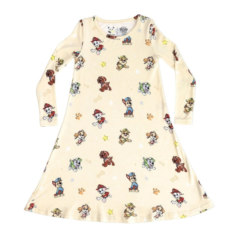 Bellabu Bear Bamboo Girls' Long Sleeve Dress Paw Patrol in cream, featuring colorful characters, stars and paw prints, shown laid flat.