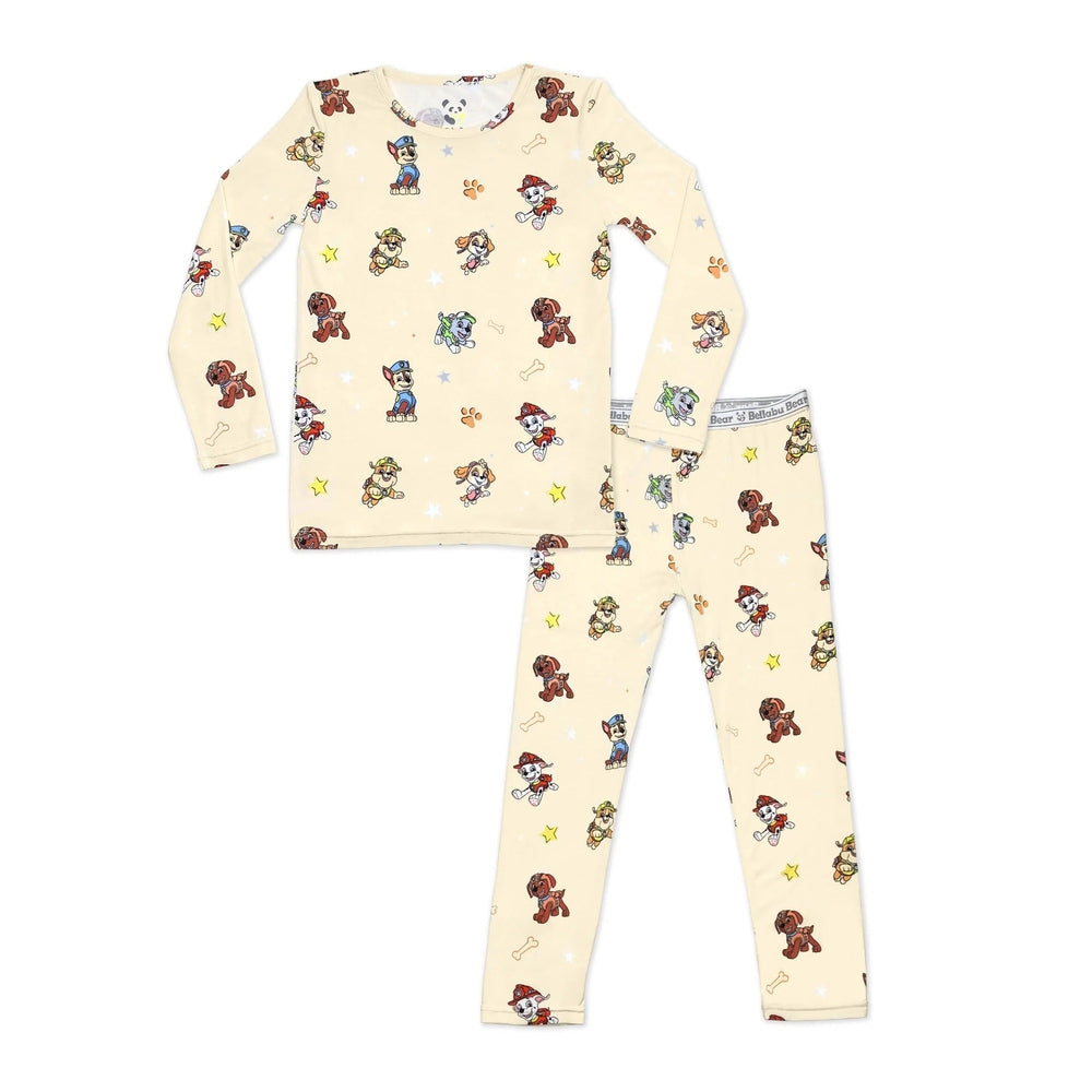 Bellabu Bear Paw Patrol Bamboo Kids Pajamas set in cream, long-sleeve top and pants, laid flat to show playful Paw Patrol pattern.