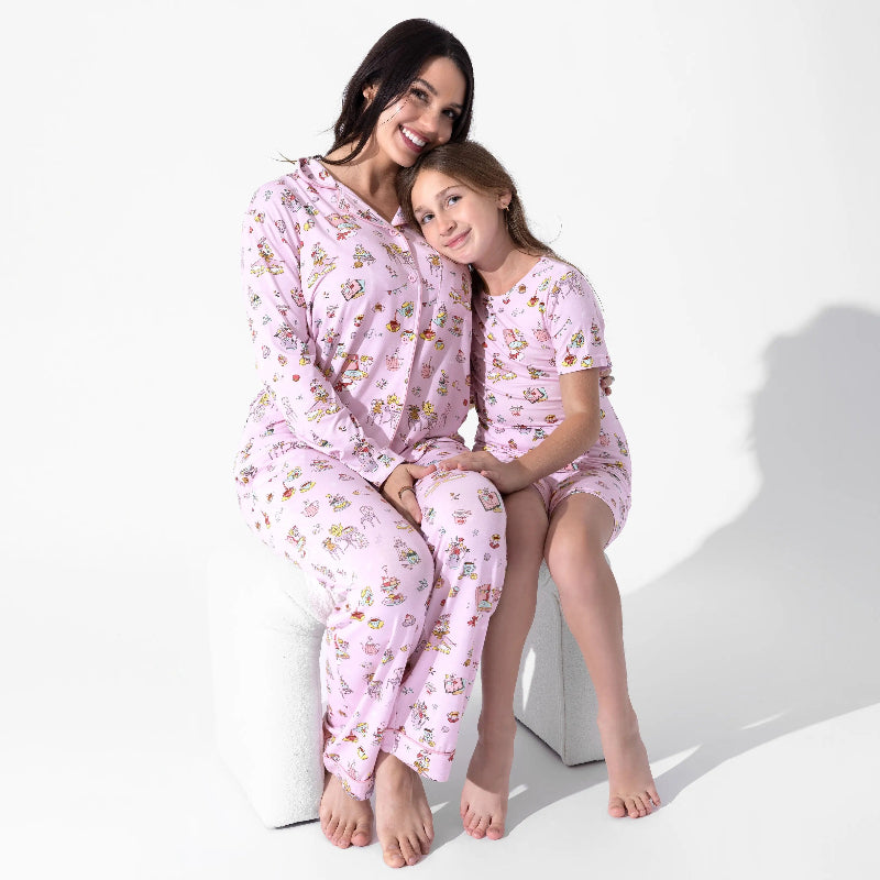 Bellabu Bear Bamboo Women's Pajama Set Tea Party in pink; mother and daughter cuddle on a white stool, showcasing soft bamboo fabric.