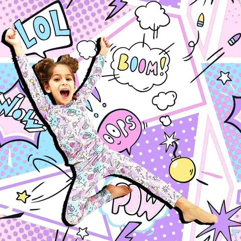 Bellabu Bear Comic Purple Bamboo Kids Pajamas Two-Piece Set worn by a joyful child mid-jump in a vibrant comic-book scene.
