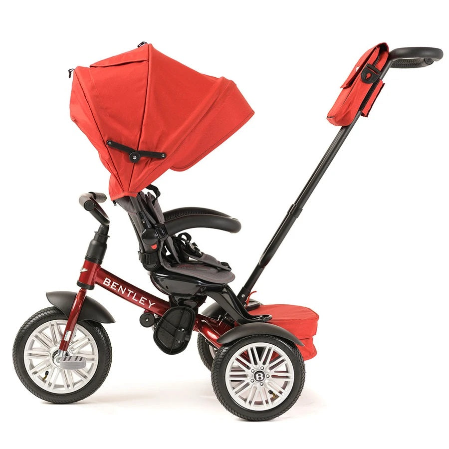 Bentley Trike 6-In-1 V2 Dragon Red, red canopy; parent pushes with extended adjustable handle, rear storage bag.