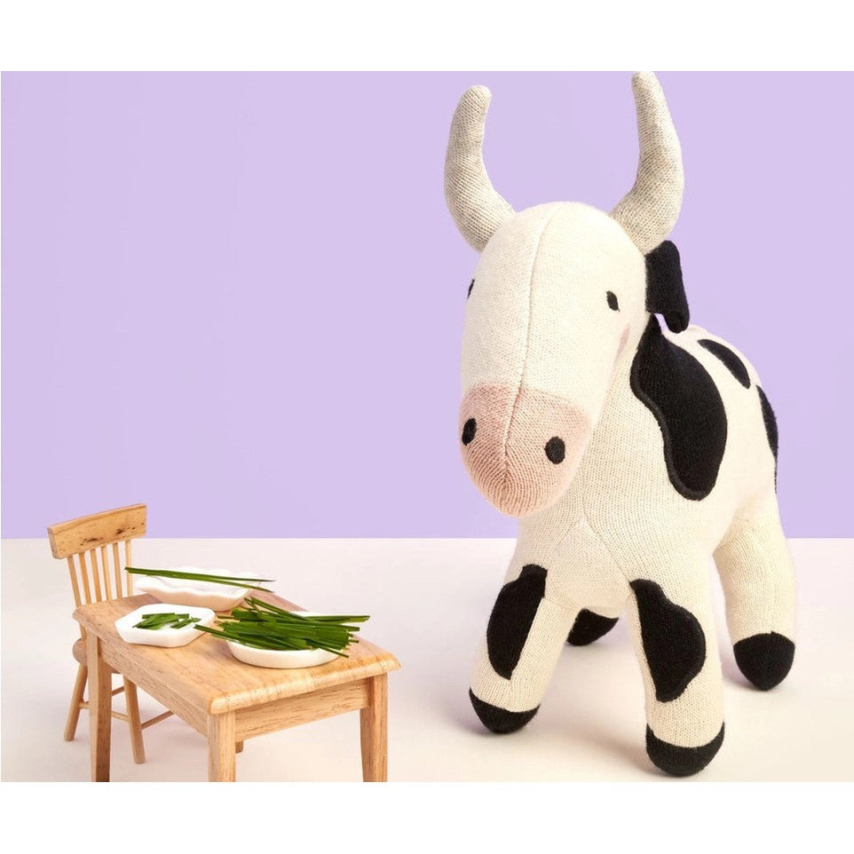 Best Years cow plush toy, knitted organic cotton in cream with black patches and pink snout.