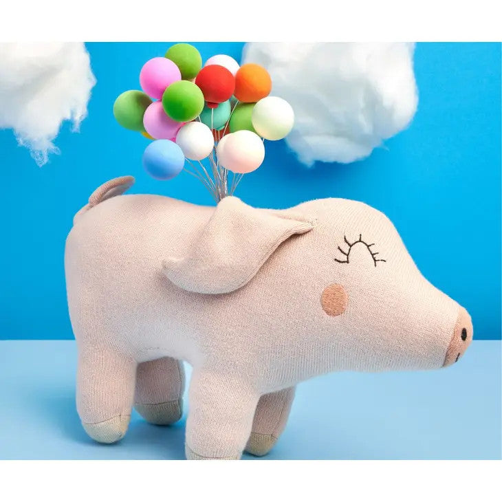 Best Years pink knitted pig plush toy in organic cotton with a colorful balloon bouquet