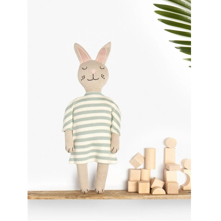 BEST YEARS organic cotton knitted bunny plush toy in pale mint stripes, standing beside wooden blocks