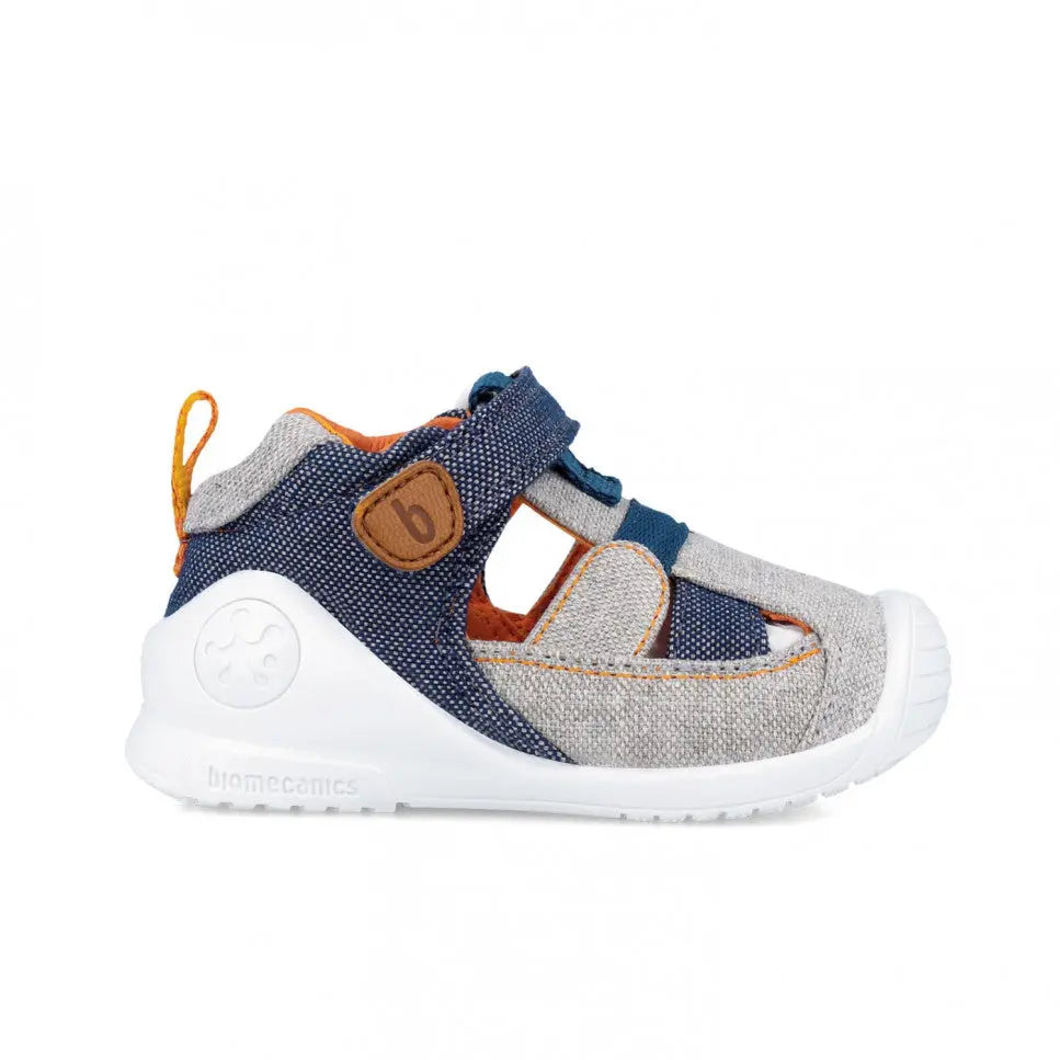Biomecanics Canvas Sandals Azul Marino, navy/grey fabric with orange trim, Velcro straps securing a toddler's foot.