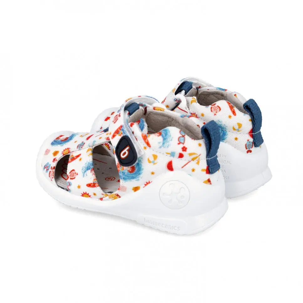 Biomecanics Canvas Sandals Blanco for babies; white sandals with a colorful print and adjustable strap securing the foot.