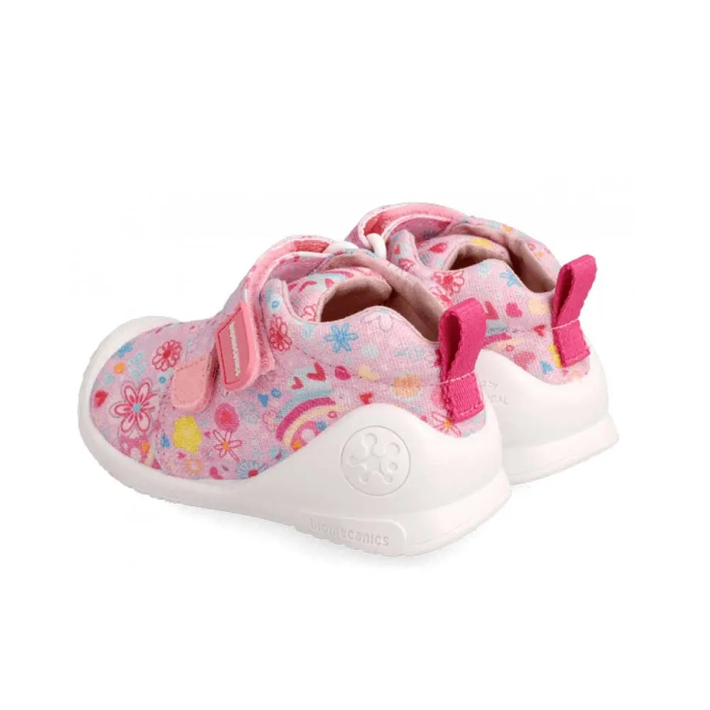 Biomécanics Rose Y Flores baby shoes in pink floral fabric with white sole and Velcro straps fastened.