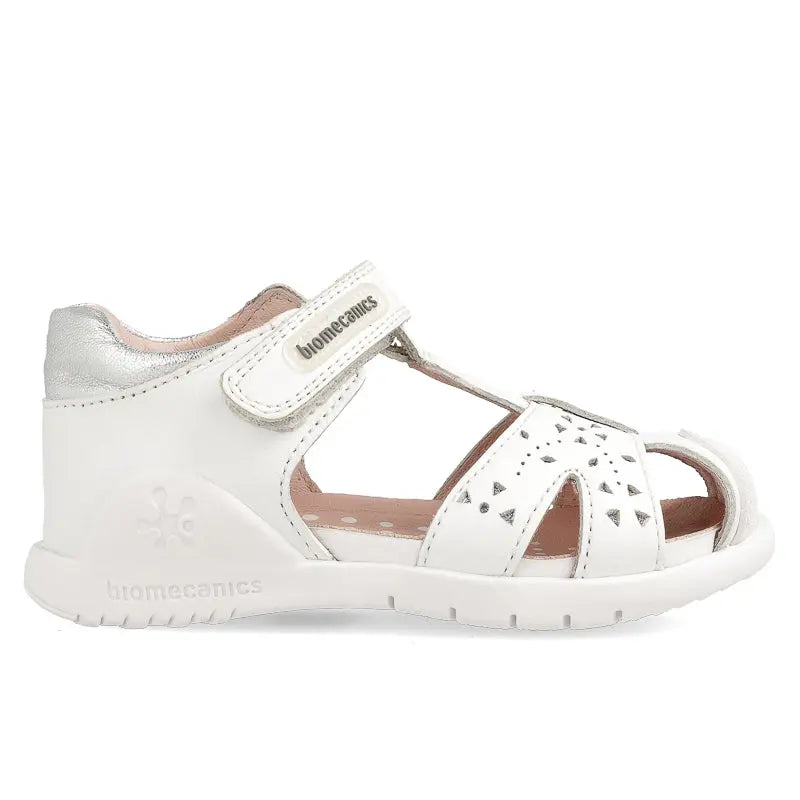 Biomecanics Sandalla Blanco white toddler sandal with Velcro strap, triangular perforations, and cushioned sole.