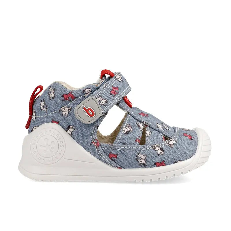 Biomecanics Sandalla Vaquero Y denim baby sandal with red laces and white sole, secured by Velcro strap