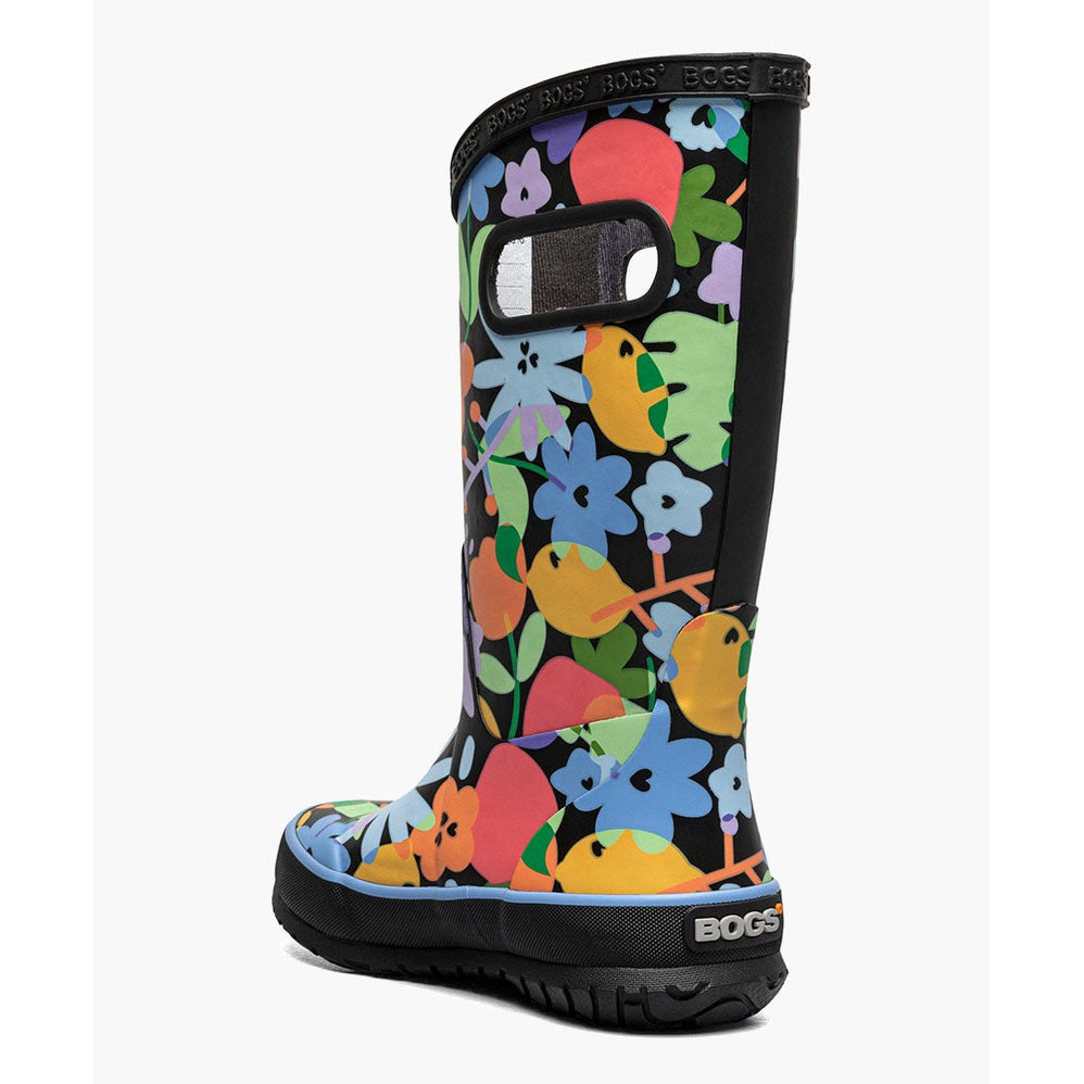 BOGS Rainboot Overlap Flowers in vivid multicolor florals with black trim, shown upright to reveal the rugged, gripped sole.
