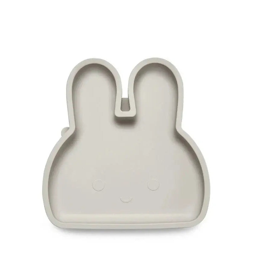 Bopomofo Bunny Silicone Plate with Suction Base in beige, clinging to table during mealtime.