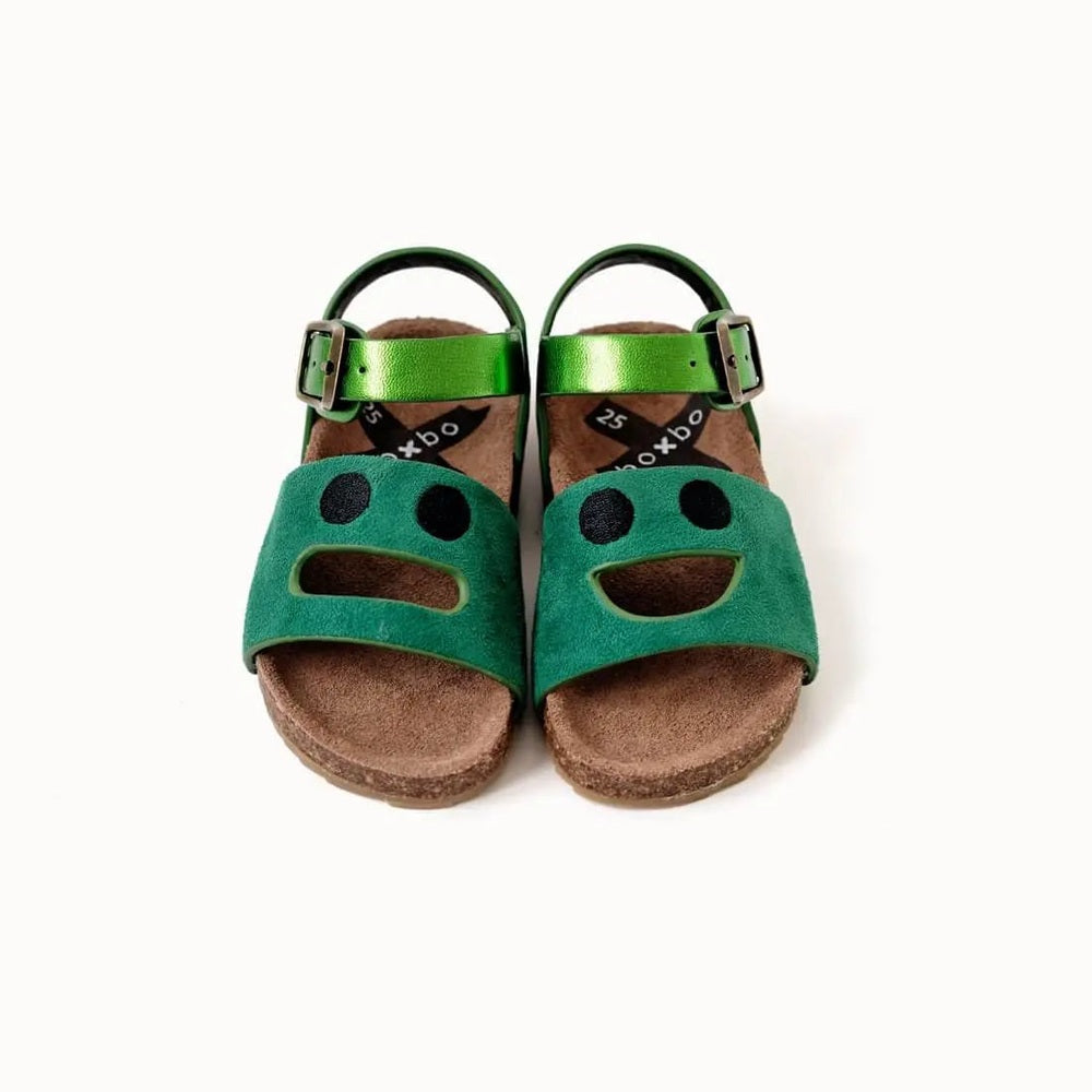 Boxbo Cork Sandal Wistiti Green pair for kids, metallic green straps buckled, cork footbeds visible side by side.