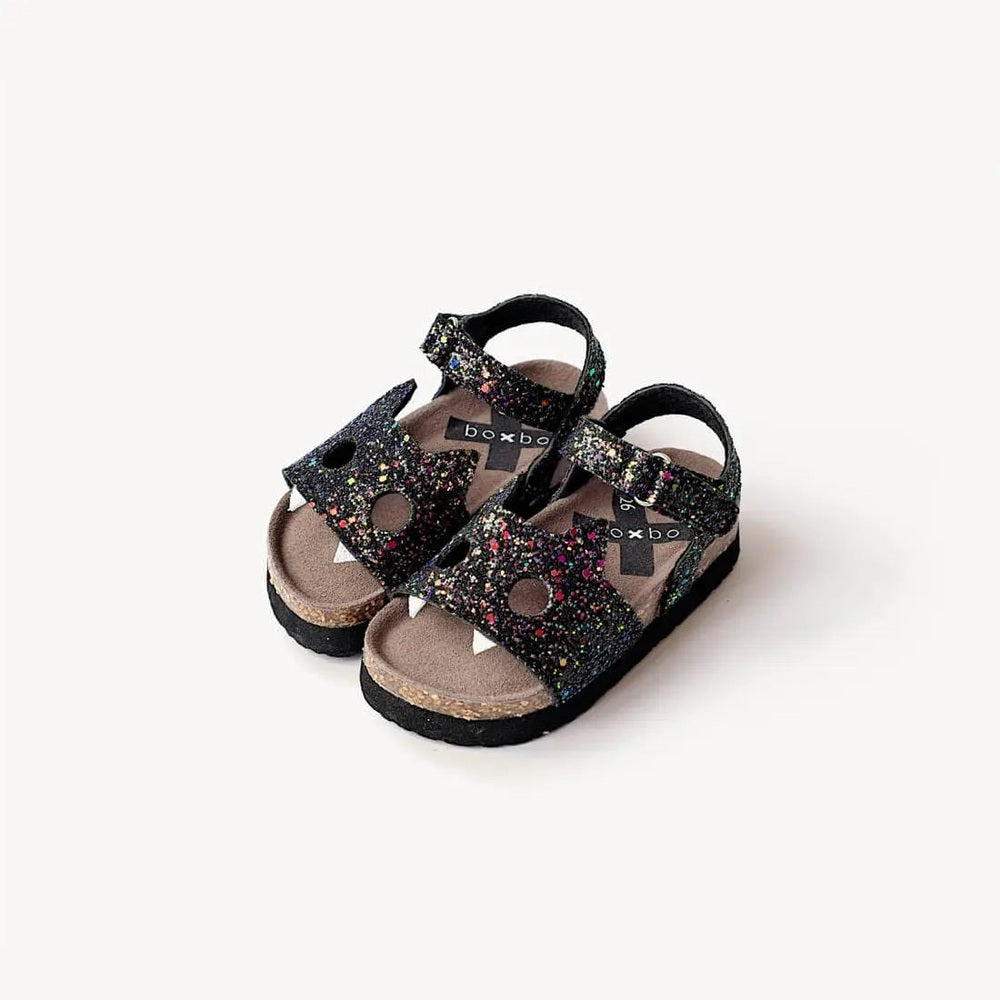 Boxbo Fox Cork Clog Unisex Sandal in black glitter with cork footbed and two adjustable glitter straps.