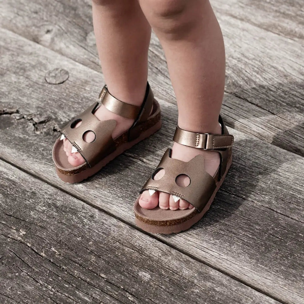 Boxbo Fox Cork Clog Unisex Sandal Coffee worn by toddler with bronze-brown straps, cork sole, Velcro.