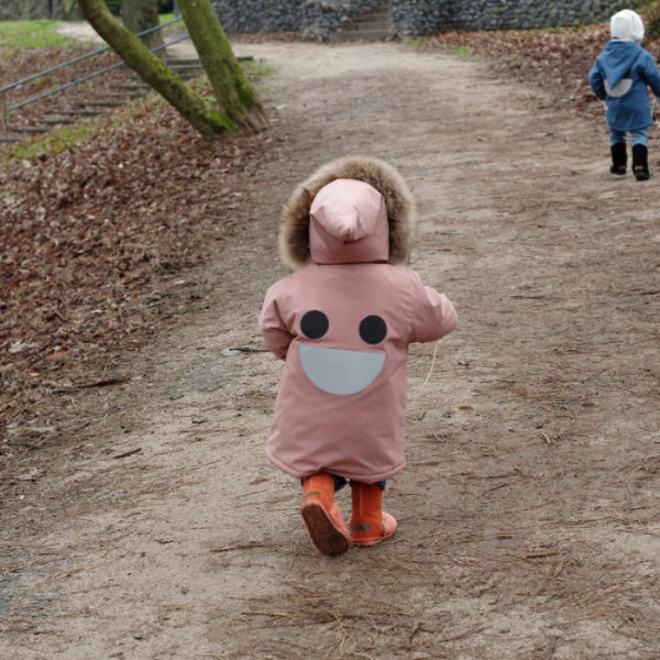 Boxbo Wistiti Fleece Lined Waterproof & Snowproof Fur Jacket Dusty Rose Pink; child walks along a woodland path in a fur-trim hood.