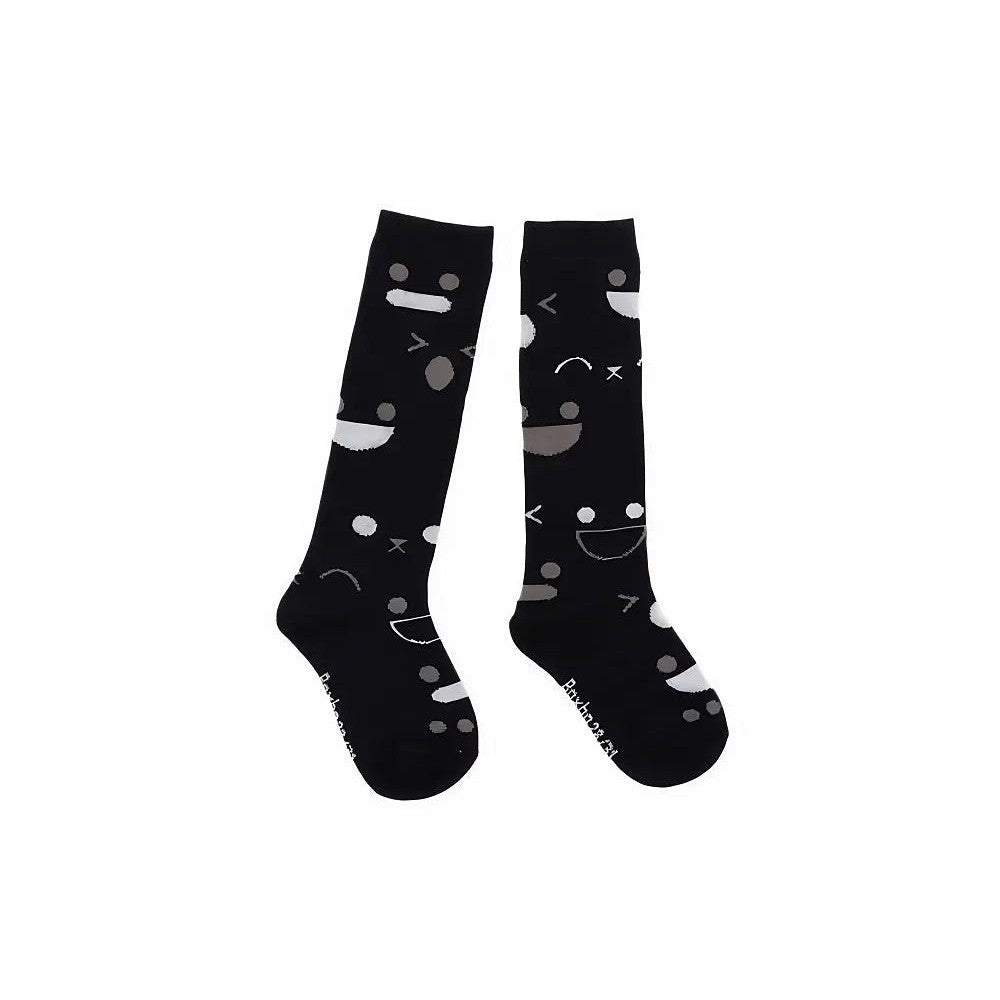 Boxbo Wistiti High Socks Black two-pack with gray smiley shapes worn on feet.
