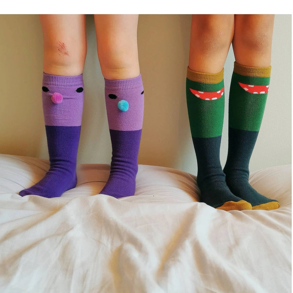 Boxbo Wistiti High Sock Violet, purple knee-high socks with cute face accents, worn by kids; four pairs shown