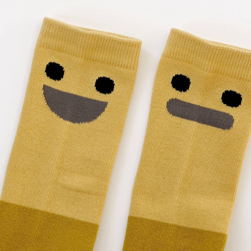 Boxbo Wistiti High Sock Yellow pair, bright baby socks with black smiley faces shown flat to reveal ribbed cuffs.