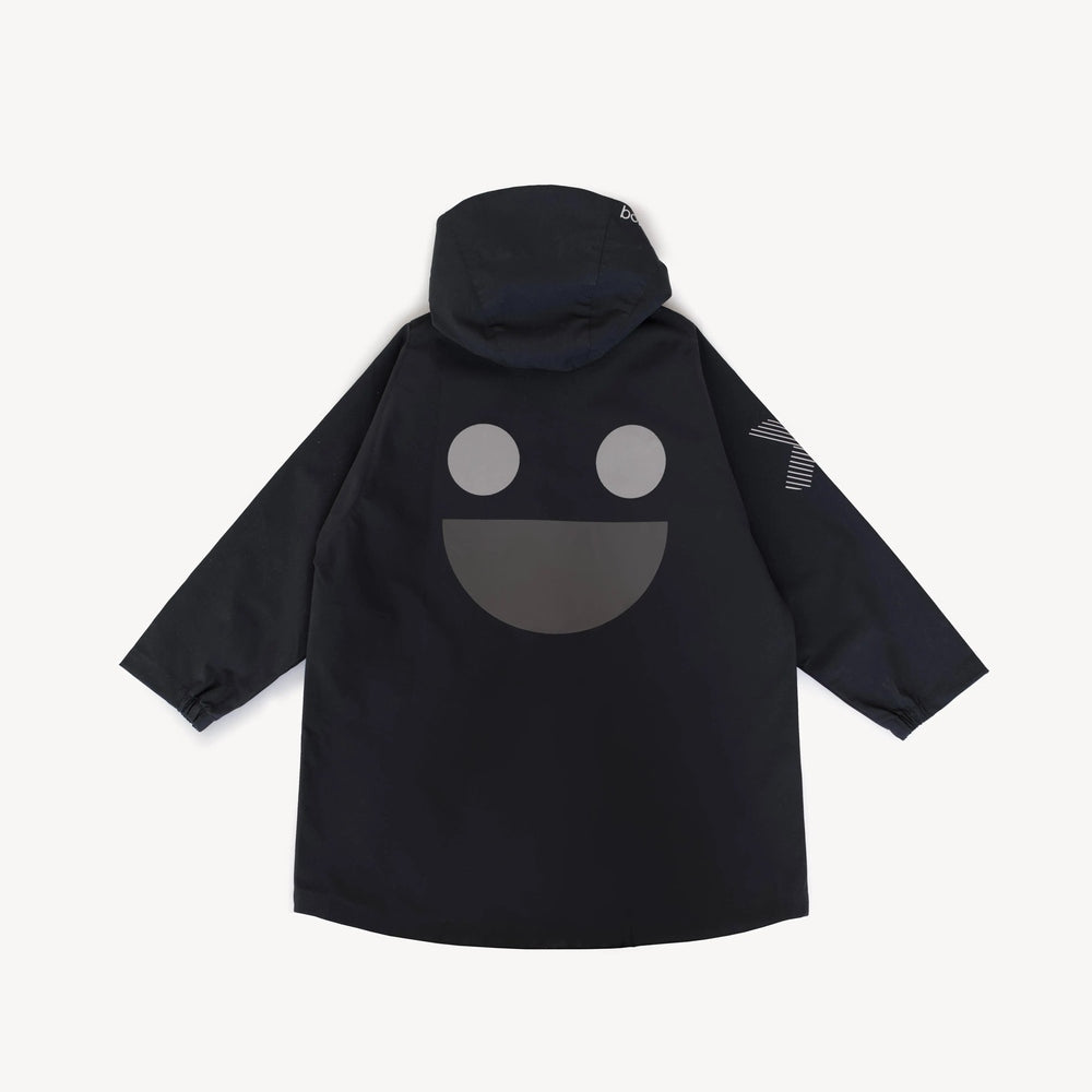 Boxbo Wistiti Windbreaker Rain Jacket Black hooded, back features large gray smile graphic—kid-friendly outerwear.