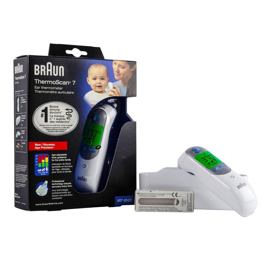 Braun ThermoScan 7 ear thermometer in white with green LCD display, shown with its packaging.
