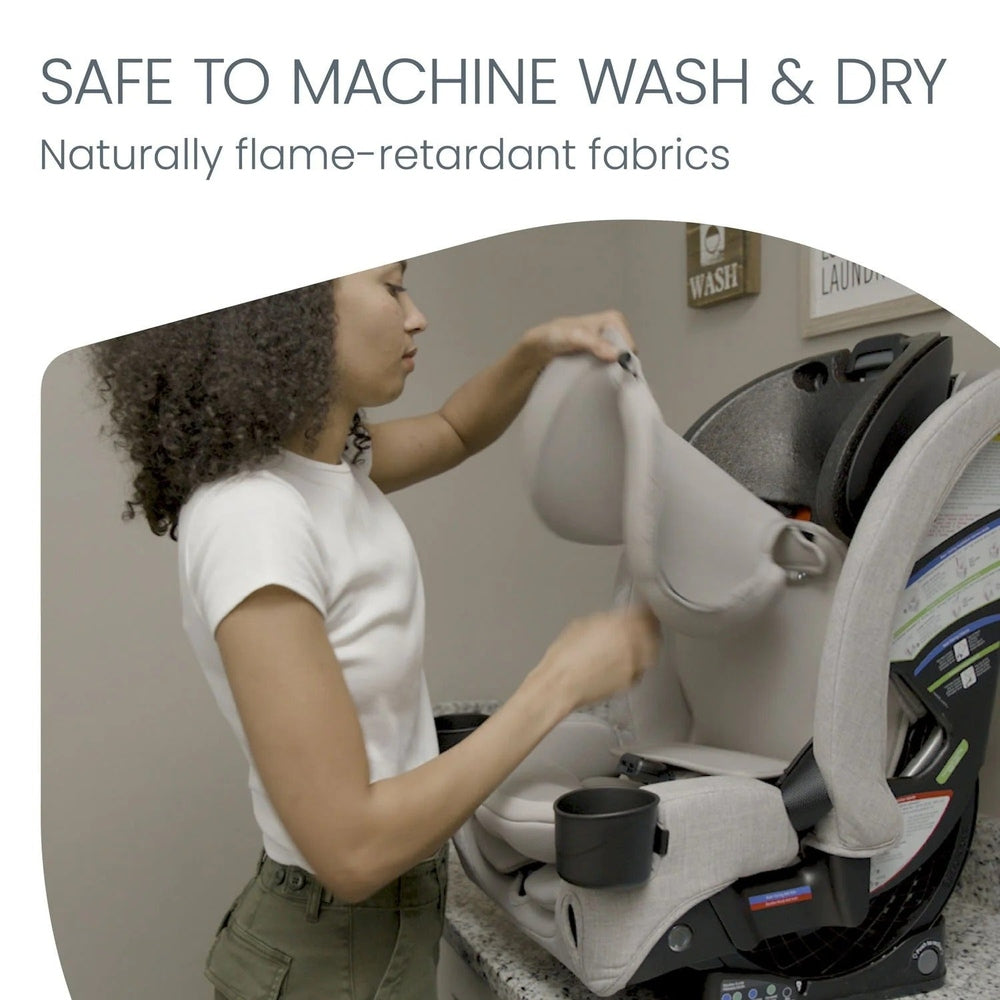 Britax One4Life Slim ClickTight all-in-one car seat in light gray being installed by a parent.