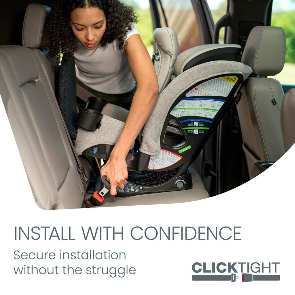 BRITAX One4Life Slim ClickTight All-in-One Car Seat being installed in a vehicle as a parent tightens the base strap.