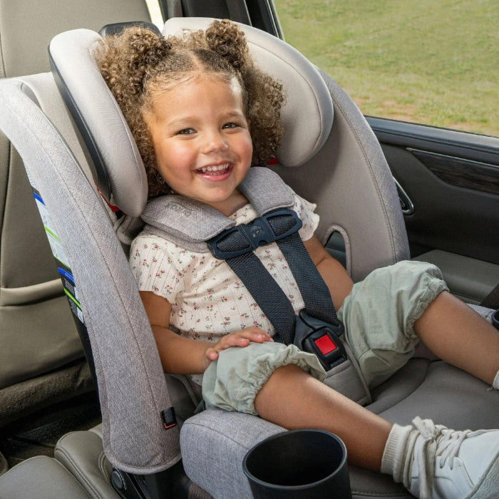 Britax One4Life Slim ClickTight All-in-One Car Seat; gray, secure 5-point harness with smiling toddler buckled in.