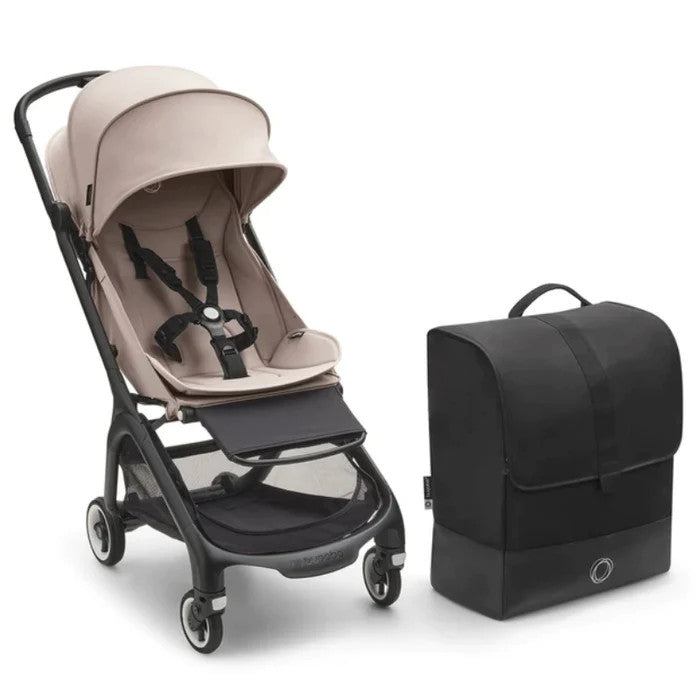Bugaboo Butterfly Transport Bag in black, shown beside a beige stroller as a travel accessory.