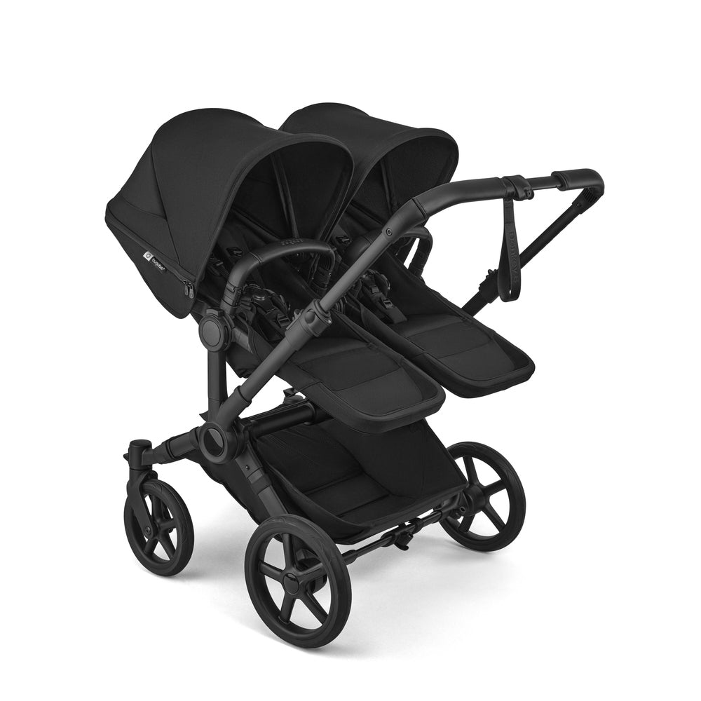 Bugaboo Donkey 6 Mono Stroller in Black with twin seats and canopies, front-left view.