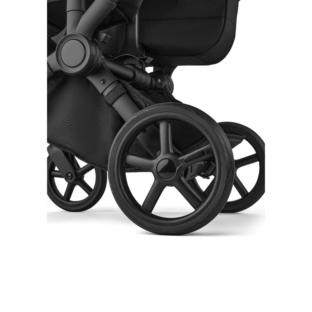 Bugaboo Donkey 6 Mono Stroller in Black with large front wheel and small rear wheels side view.