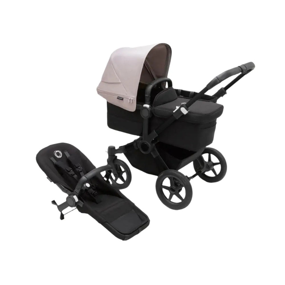 Bugaboo Donkey5 Mono stroller with beige bassinet on black chassis; separate black seat unit shown nearby.