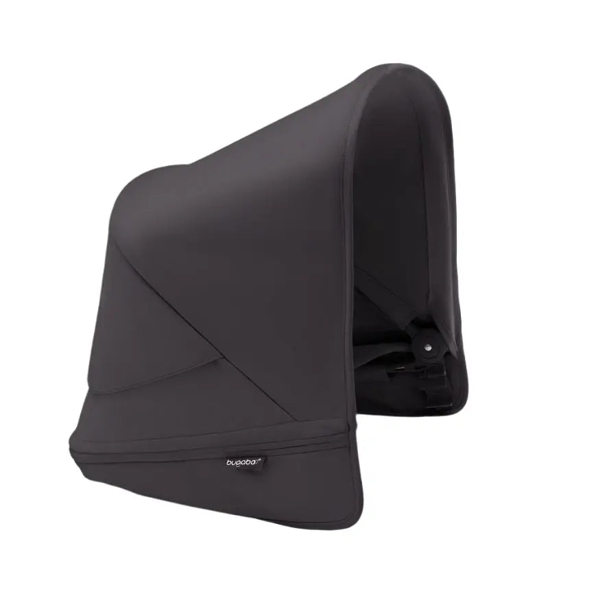 Bugaboo Donkey5 Sun Canopy in dark gray fabric shielding a stroller seat from sun.