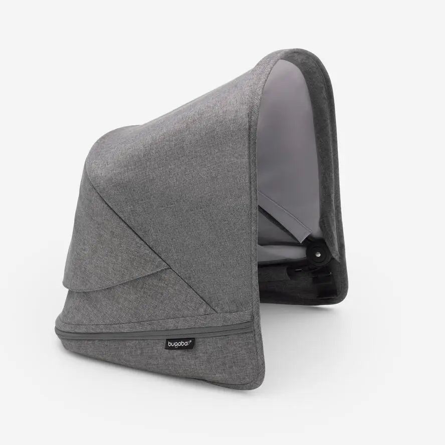 Bugaboo Donkey5 sun canopy in grey fabric, shown attached to a stroller with a protective hood.