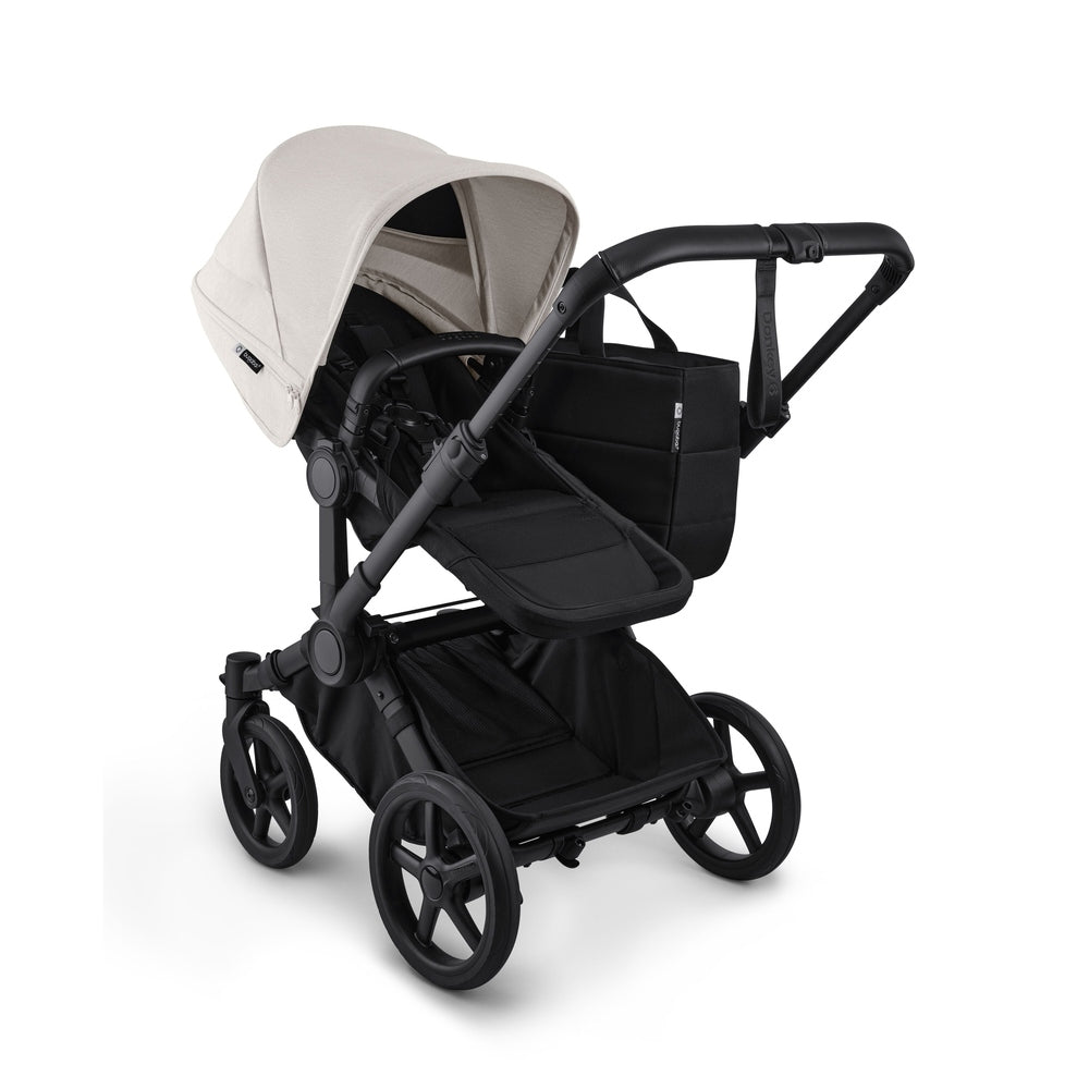 Bugaboo Donkey6 Mono Stroller in Cream Beige with black frame and seat, side view.