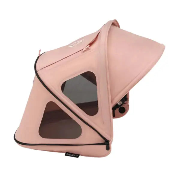Bugaboo Dragonfly Breezy Sun Canopy in pink attached to a Bugaboo stroller, showing breathable mesh windows.