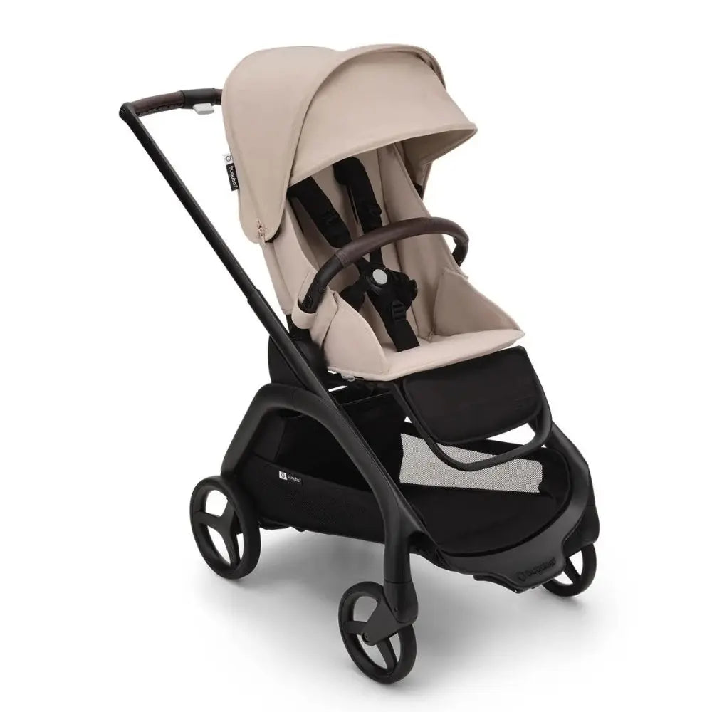 Bugaboo Dragonfly Stroller Complete in beige fabric with black frame and wheels, canopy extended and storage basket visible.