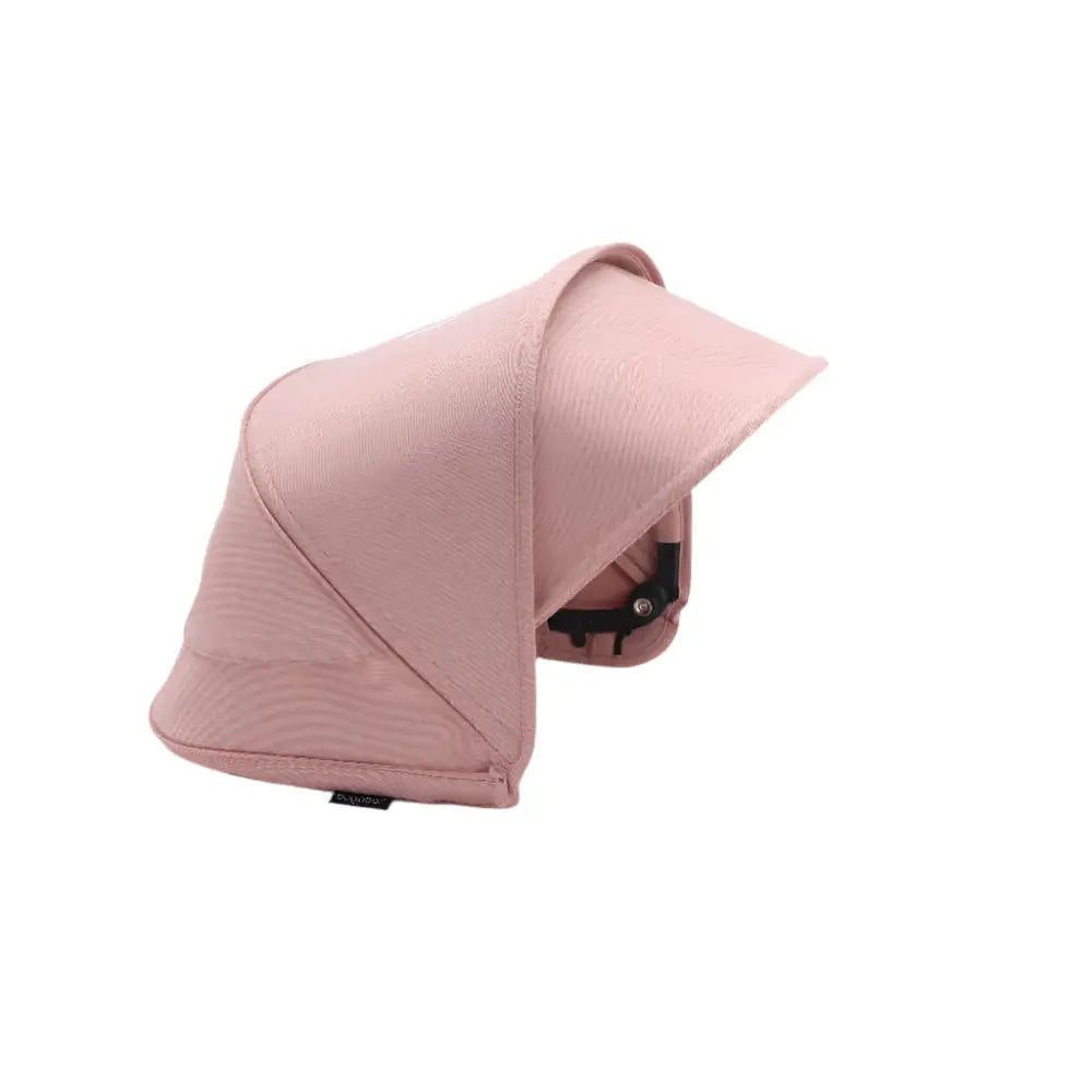 Bugaboo Dragonfly Sun Canopy in pink fabric, shown extended to shade a stroller.
