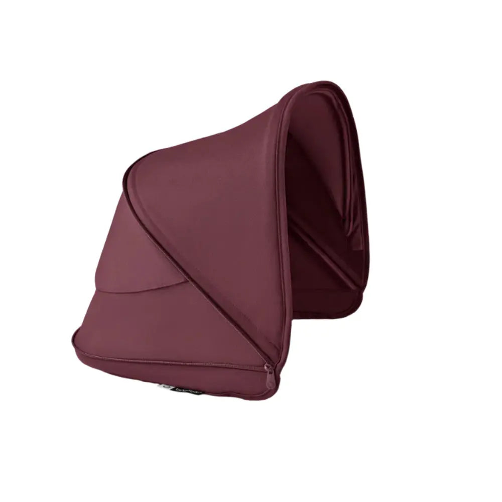 BUGABOO Dragonfly Sun Canopy in burgundy fabric shown attached over a stroller to shield from sun.