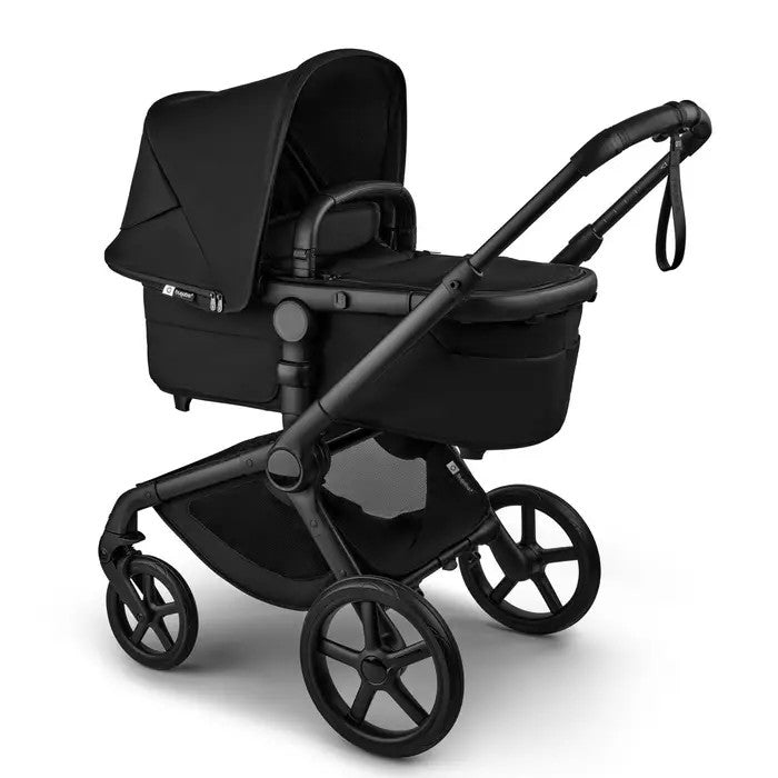 Bugaboo Fox 5 Renew Complete Stroller in black with bassinet attached and canopy raised.