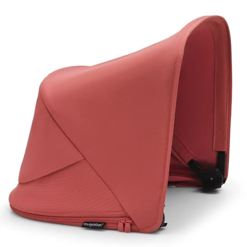 Bugaboo Fox 5 Sun Canopy coral pink attached to a stroller frame, providing full shade with zip edge.