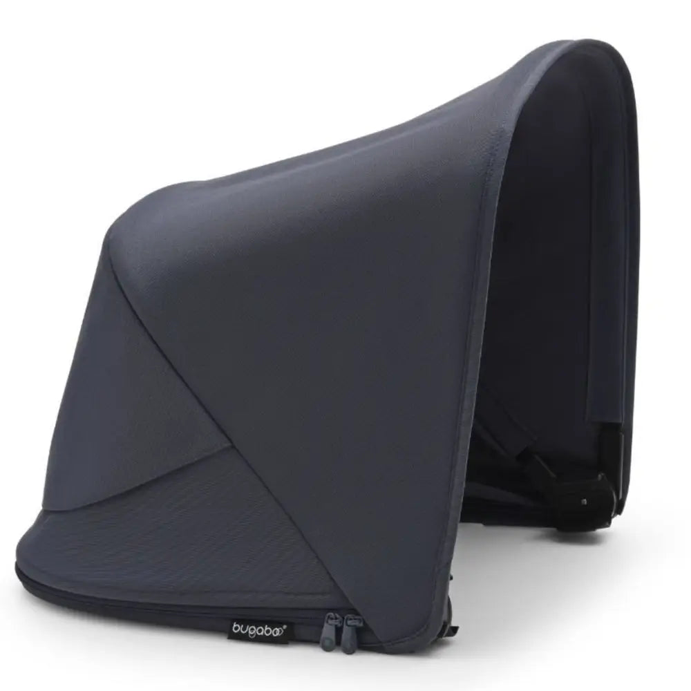 Bugaboo Fox 5 Sun Canopy in navy blue fabric, attached to a stroller to provide shade.