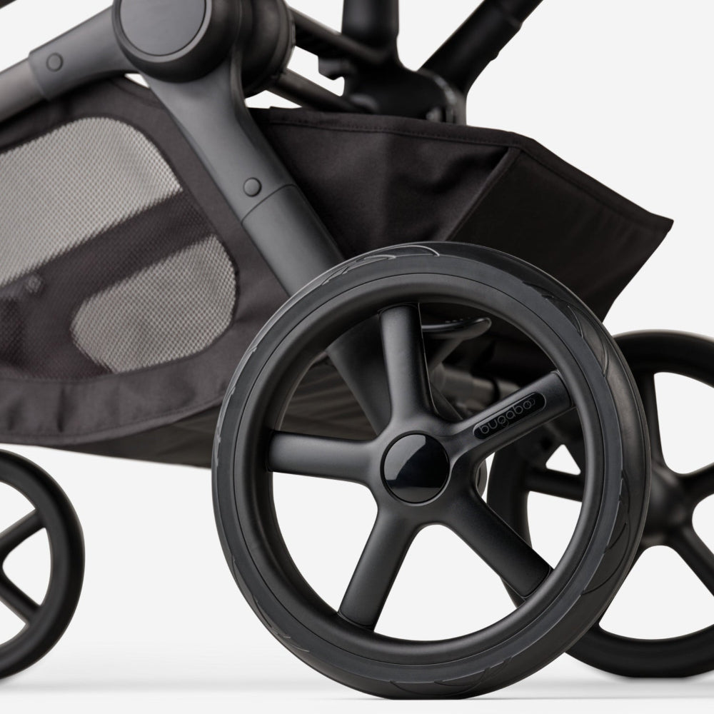 Bugaboo Kangaroo Complete Stroller in matte black, showing large wheel and sturdy frame ready to roll.