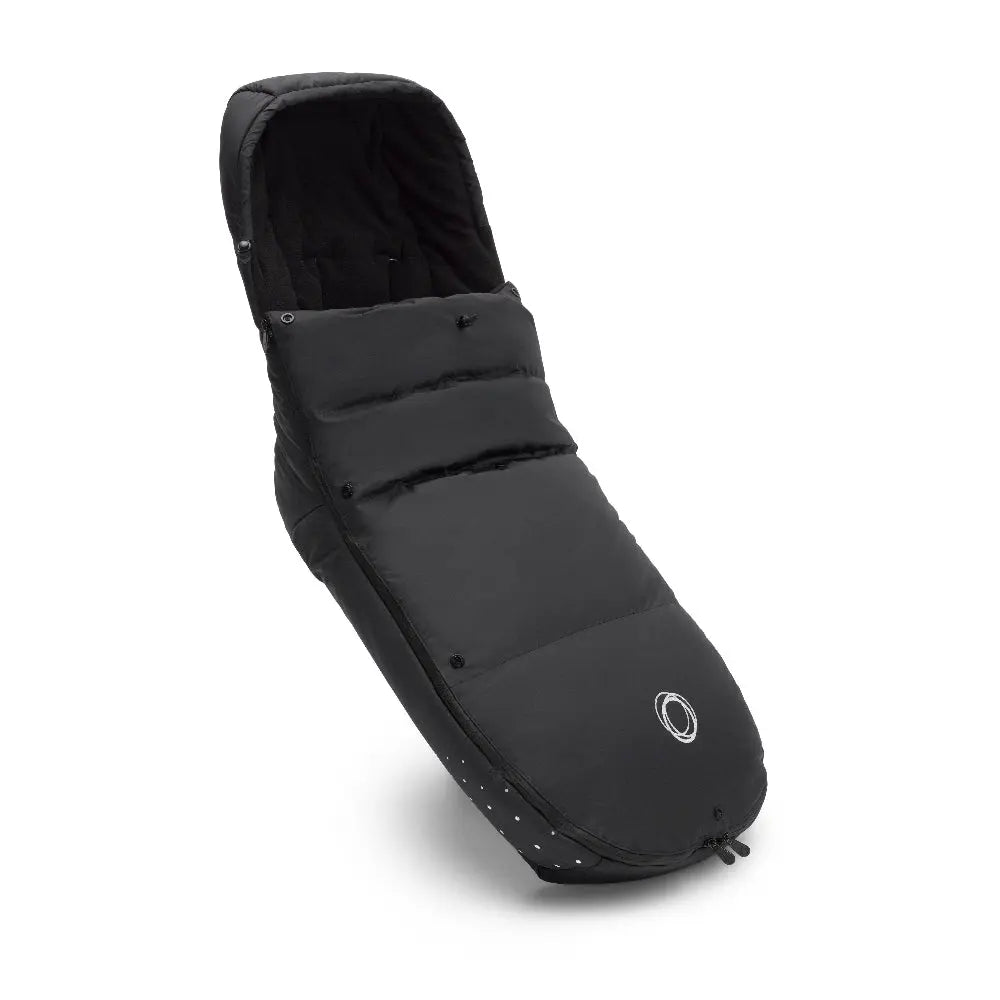 Bugaboo Performance Winter Footmuff in black, padded quilted design with zip closure, shown angled to reveal opening.