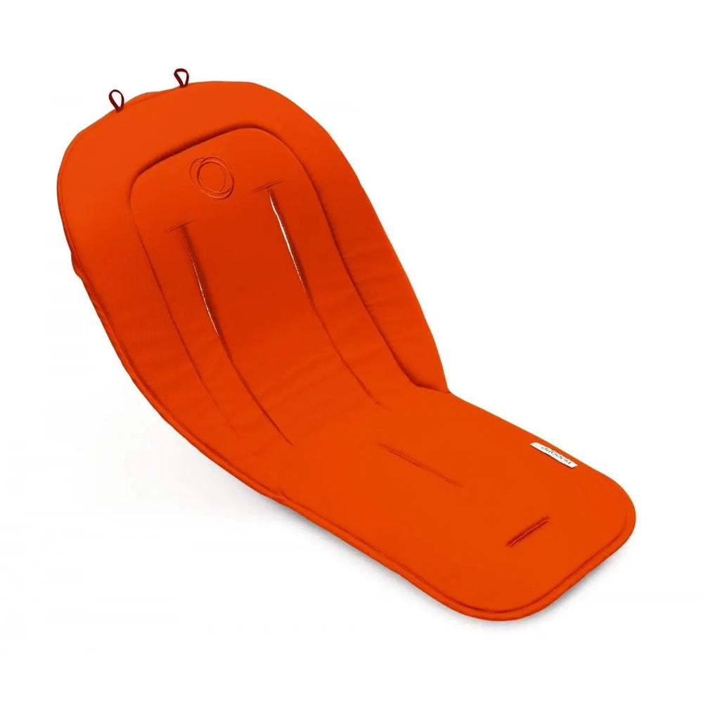 Bugaboo Seat Liner in bright orange with padded backrest and leg support, shown installed in a stroller.