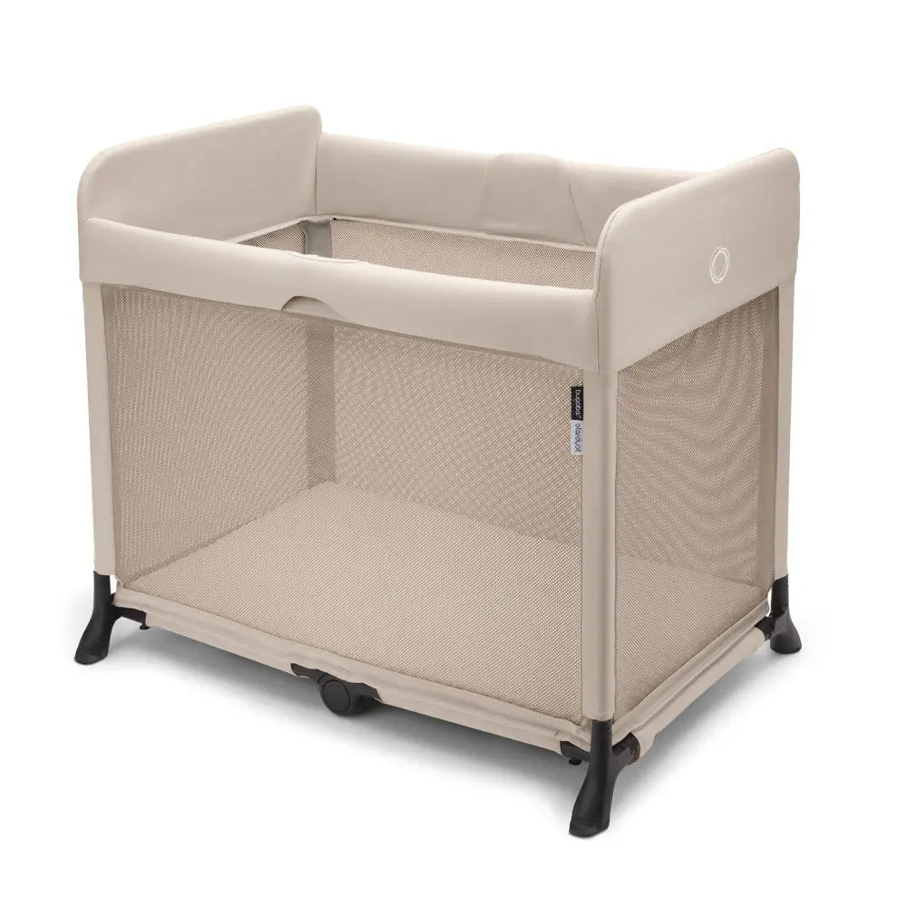 Bugaboo Stardust Playard beige with mesh sides, cushioned rails, shown assembled as a secure, breathable baby space.