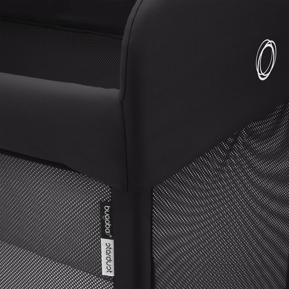Bugaboo Stardust Playard; black fabric with breathable mesh sides, logo tag visible.